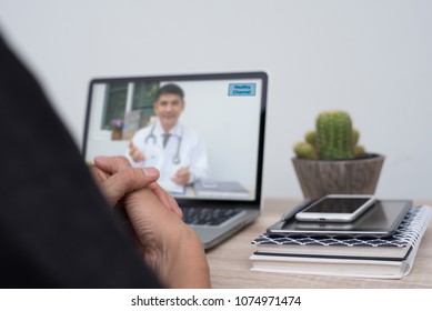 Patient Listening To Friendly Doctor Via Laptop Computer At Home Or Office, Telemedicine, E Health. People Watching Doctor On Health Channel Internet Live Broadcast, Medical Online Concept