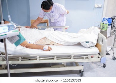 Patient Lying In Bed In Icu Room In Hospital