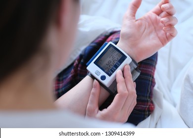 Patient measuring blood pressure. Hypertension.