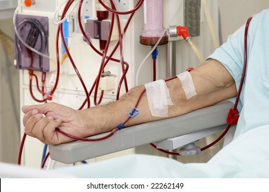 patient monitored by electronic sphygmomanometer during dialysis session