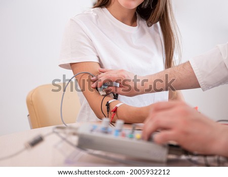 Patient nerves testing using electromyography at medical center