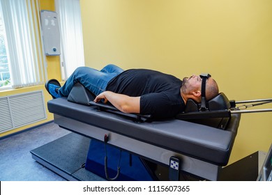 Patient at non-surgical treatment of cervical spine in medical center