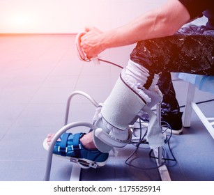 Patient On CPM (continuous Passive Range Of Motion) Machines. Device To Provide Anatomically Correct Motion To Both The Ankle And Subtalar Joints. Foot's Rehabilitation After Injured