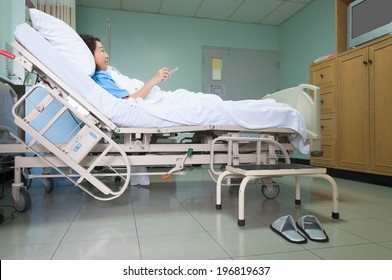 Patient On Gurney And Watching TV In Hospital Room.