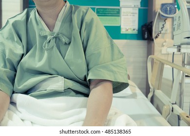 Patient On The Hospital Bed. Sick Person Stay In Hospital In Bad Mood. Vintage Tone