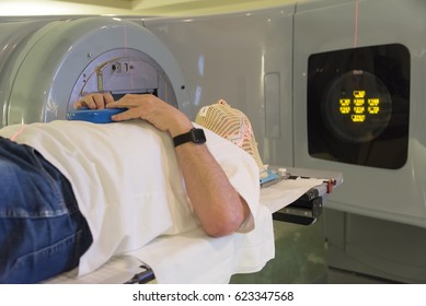 Patient Radiation Therapy Mask Showing Laser Lines For Targeting Cancer Cells In The Brain