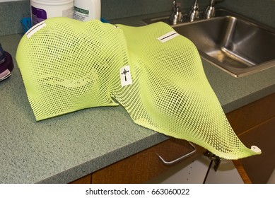 Patient Radiation Therapy Mask Showing Laser Markings For Targeting Cancer Cells In The Brain Being Removed