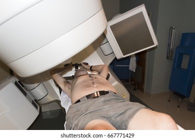 Patient Radiation Therapy Showing Laser Lines For Targeting Cancer Cells In The Brain And Throat