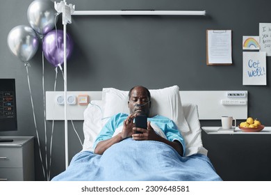 Patient reading message on smartphone - Powered by Shutterstock