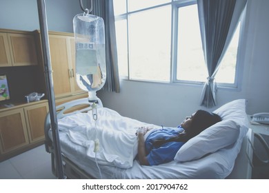 Patient Receiving Fluids Through An Intravenous Line In The Wrist While Admitted In Hospital. IV Therapy Is A Medical Technique That Delivers Fluids And Nutrition Directly Into A Person's Vein.