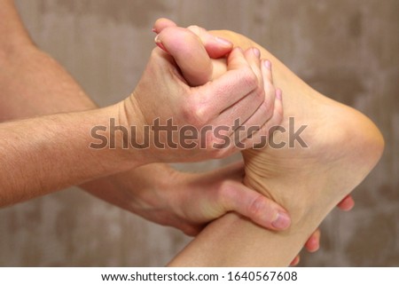 Patient receiving a foot massage. foot massage close-up.