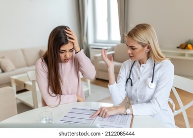 Patient Receiving Medical Bills, She Is Desperate About High Bills, Doctor Showing Her Patient The Cost For The Treatment.