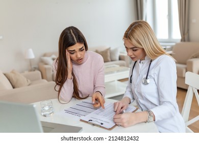 Patient Receiving Medical Bills, She Is Desperate About High Bills, Doctor Showing Her Patient The Cost For The Treatment.