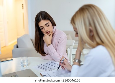 Patient Receiving Medical Bills, She Is Desperate About High Bills, Doctor Showing Her Patient The Cost For The Treatment.