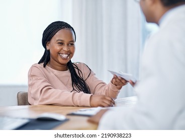 Patient Receiving Medical Script, Prescription And Sick Note From A Doctor During A Consult, Checkup And Visit In A Hospital Or Clinic. Smiling Woman Happy With Good Healthcare Service And Treatment