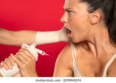 Patient Refuses To Be Vaccinated On A Red Background