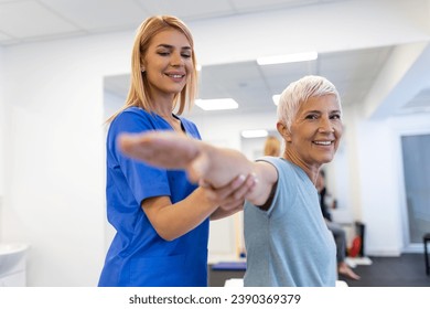 Patient stretching, physiotherapist woman and physical therapy help for muscle or arthritis exercise in consulting exam. Physiotherapy, chiropractor and healthcare rehabilitation support of woman - Powered by Shutterstock