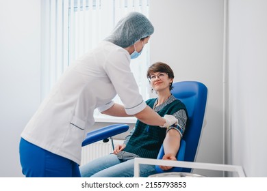 The Patient Takes A Blood Test At The Clinic. High Quality Photo