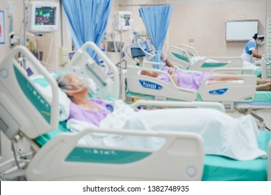 Patient With Treatment In ICU At The Hospital Blurred.