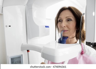 Patient Using Digital Panoramic Xray Machine In Clinic