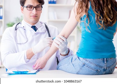 Patient Visitng Doctor For Annual Flu Shot Inoculation For Preve