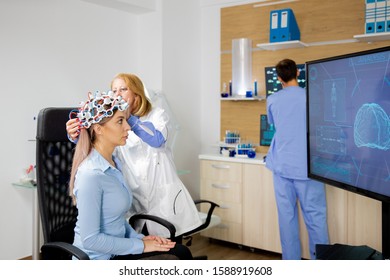 Patient Who Undergoes A Brain Scan Procedure In A Neurological Center. Neurology Scanning Headset