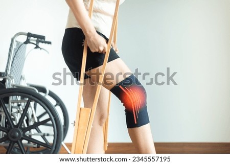 Patient woman using knee support brace and crutches on white background Stock foto © 