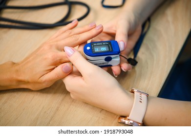 Patient's blood oxygen measurement. Pulse Oximetry - Shutterstock ID 1918793048