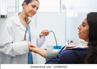 Patients Blood Pressure Being Checked By Doctor In Hospital Room, Healthcare Workers In The Coronavirus Covid19 Pandemic