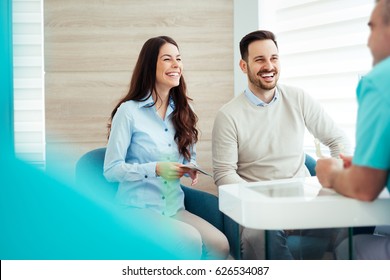 Patients Consulting The Dentist At Dental Clinic