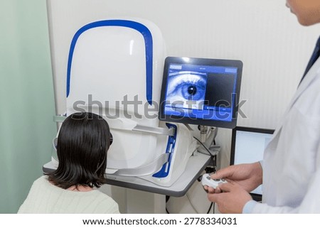 Patients and doctors using visual acuity and fundus examination equipment in ophthalmology.