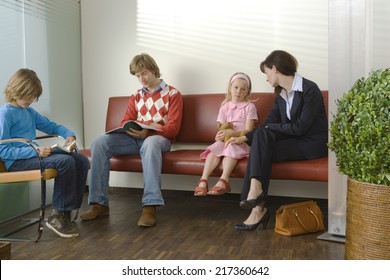 Patients Sitting In A Waiting Room