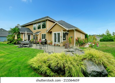 Patio Area On Walkout Backyard Deck With Beautiful Landscape