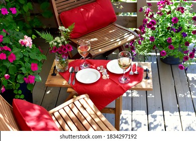 Patio Deck And Garden Setting For Secluded Casual Dining In Home Backyard For Relaxing Staycation Evening On Warm Summer Day