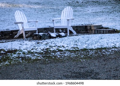 Patio Furniture Covered In A Light Layer Of Snow