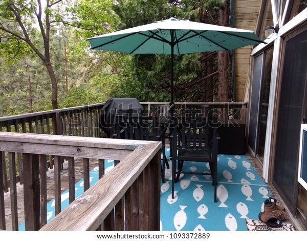 Patio Furniture Umbrella On Deck Forest Stock Photo Edit Now