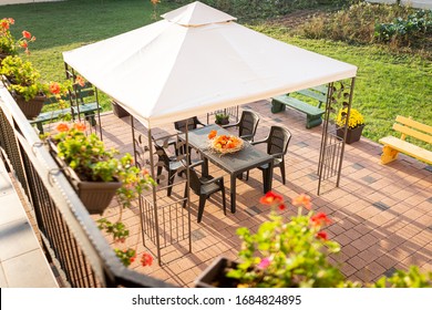 Patio With Garden Furniture And Parasol