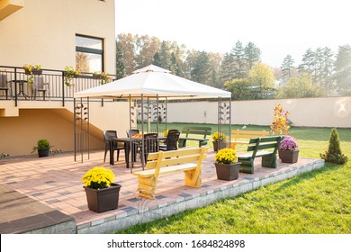Patio with garden furniture and parasol