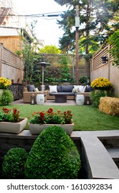 Patio. Garden. Urban, Neutral, Outdoor Living Space. Exterior Photo. Outdoor Living Room With Couch, Comfy Cushions, Throw Pillows, Love Seat, Chairs And Coffee Table. Backyard With Greenery, Plants.