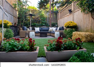 Patio. Garden. Urban, Neutral, Outdoor Living Space. Exterior Photo. Outdoor Living Room With Couch, Comfy Cushions, Throw Pillows, Love Seat, Chairs And Coffee Table. Backyard With Greenery, Plants.