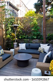 Patio. Garden. Urban, Neutral, Outdoor Living Space. Exterior Photo. Outdoor Living Room With Couch, Cushions Pillows, Love Seat, Chairs And Coffee Table. Backyard With Greenery, Plants And Flowers.