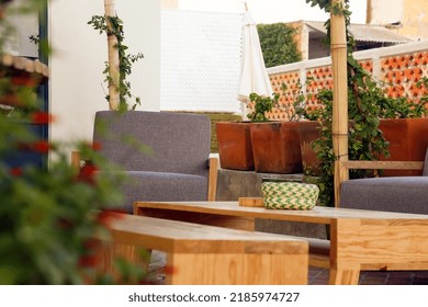 Patio. Garden. Urban, Neutral, Outdoor Living Space. Exterior Photo. Outdoor Living Room With Couch, Comfy Cushions, Throw Pillows, Love Seat, Chairs And Coffee Table. Backyard With Greenery, Plants.