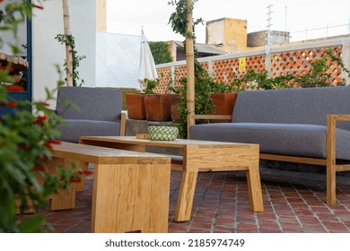 Patio. Garden. Urban, Neutral, Outdoor Living Space. Exterior Photo. Outdoor Living Room With Couch, Comfy Cushions, Throw Pillows, Love Seat, Chairs And Coffee Table. Backyard With Greenery, Plants.