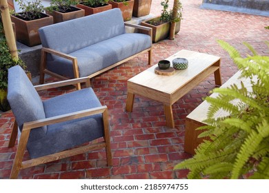 Patio. Garden. Urban, Neutral, Outdoor Living Space. Exterior Photo. Outdoor Living Room With Couch, Comfy Cushions, Throw Pillows, Love Seat, Chairs And Coffee Table. Backyard With Greenery, Plants.