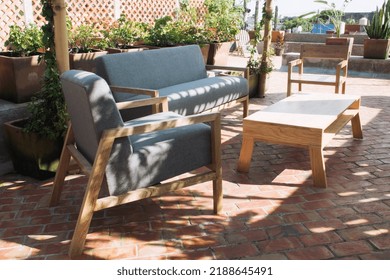 Patio. Garden. Urban, Neutral, Outdoor Living Space. Exterior Photo. Outdoor Living Room With Couch, Comfy Cushions, Throw Pillows, Love Seat, Chairs And Coffee Table. Backyard With Greenery, Plants.