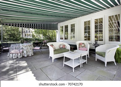 Patio In Luxury Home With Green Awning