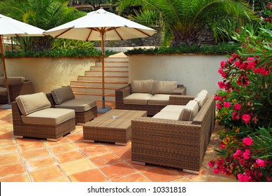 Patio Of Mediterranean Villa In French Riviera With Wicker Furniture