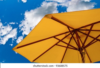 Patio Umbrella Against Sunny Blue Sky