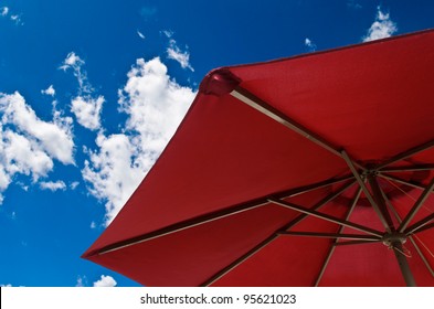 Patio Umbrella Against Sunny Blue Sky