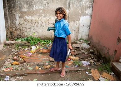 Patna, Bihar, India,  25th July 2013: Student With Food Plate After Finishing Mid Day Meal Lunch  In Secondary School Of Rural India. 